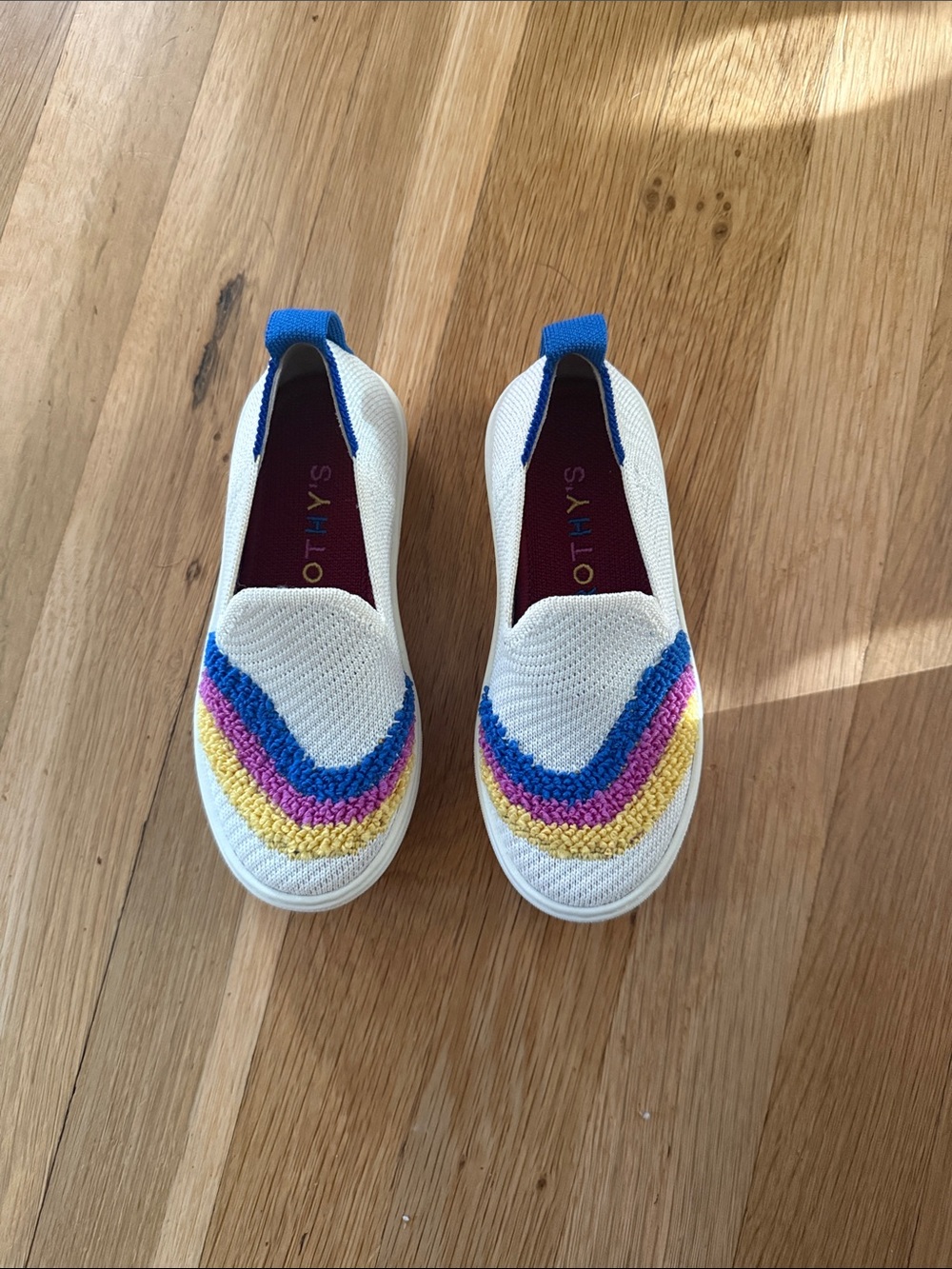 Rothy's Kids White Slip-On Sneakers with Blue, Pink & Yellow Design